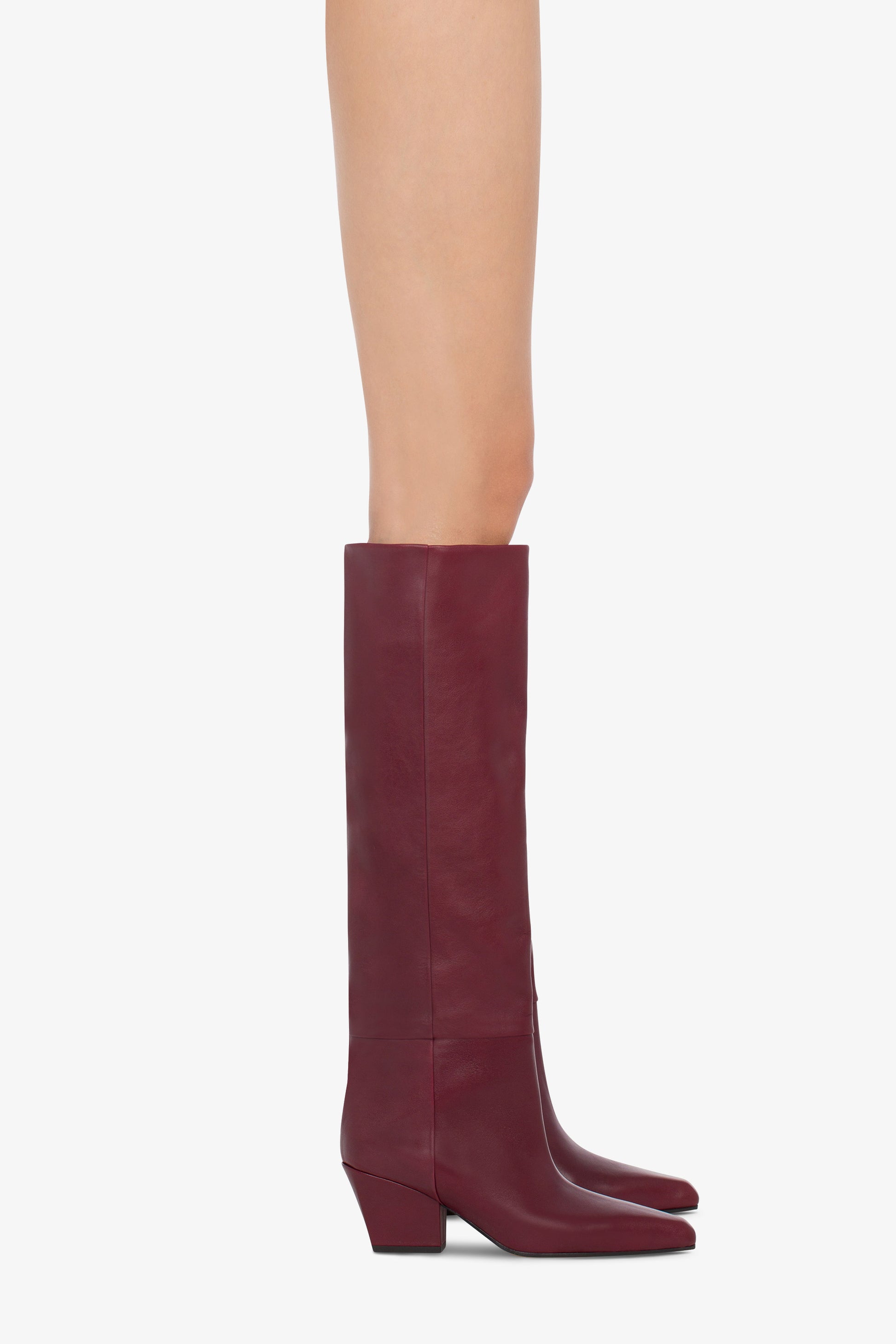 Knee-high, long pointed boot in supple rouge noir leather - Product worn