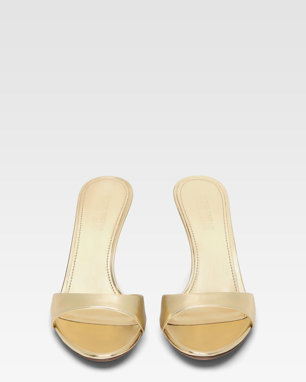 Mules in gold mirror leather