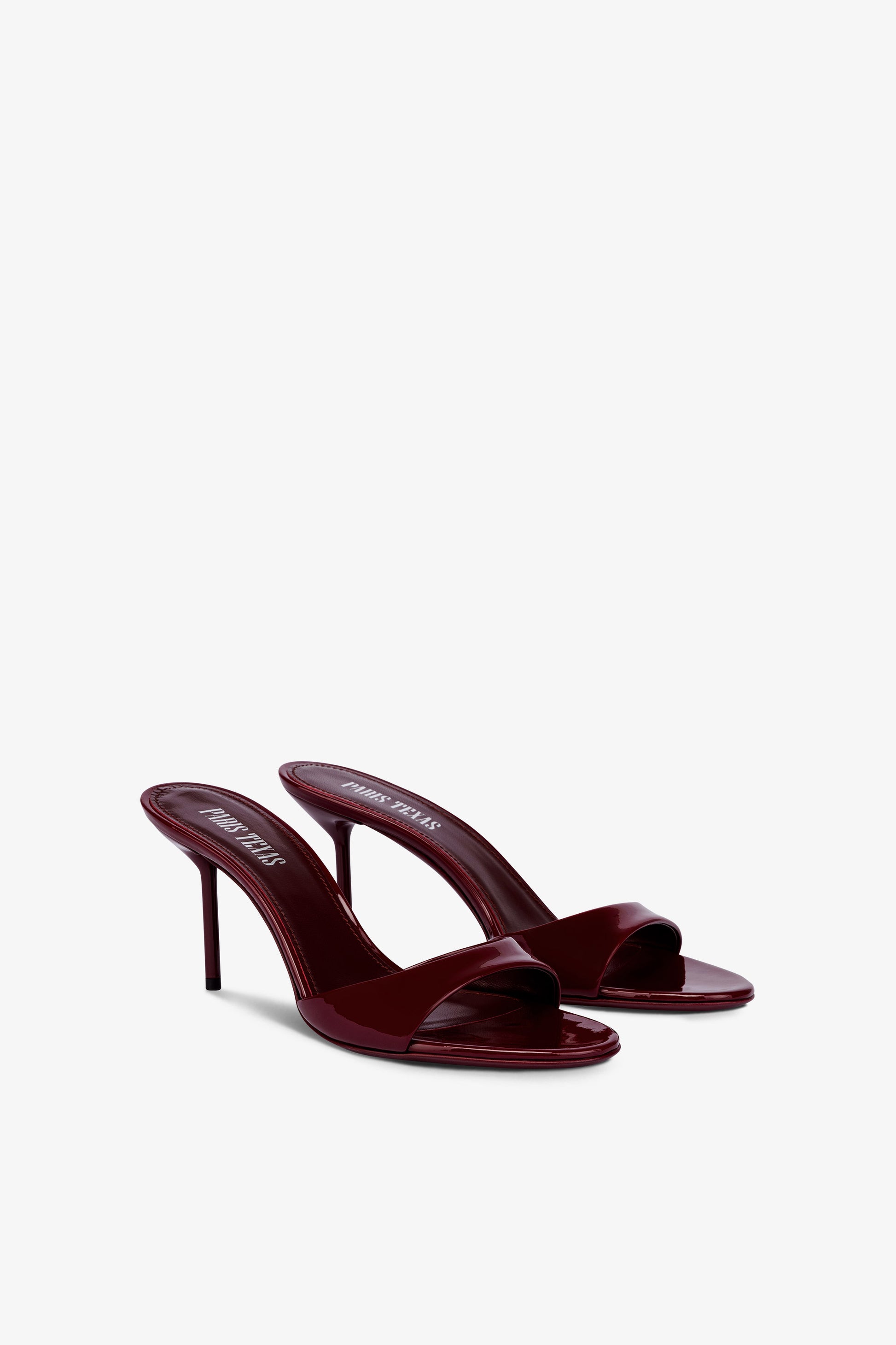 Almond-toe mules in patent rouge noir leather