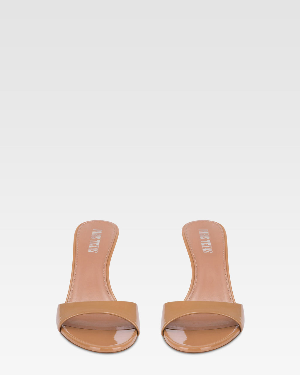 Mules in caramel patent leather