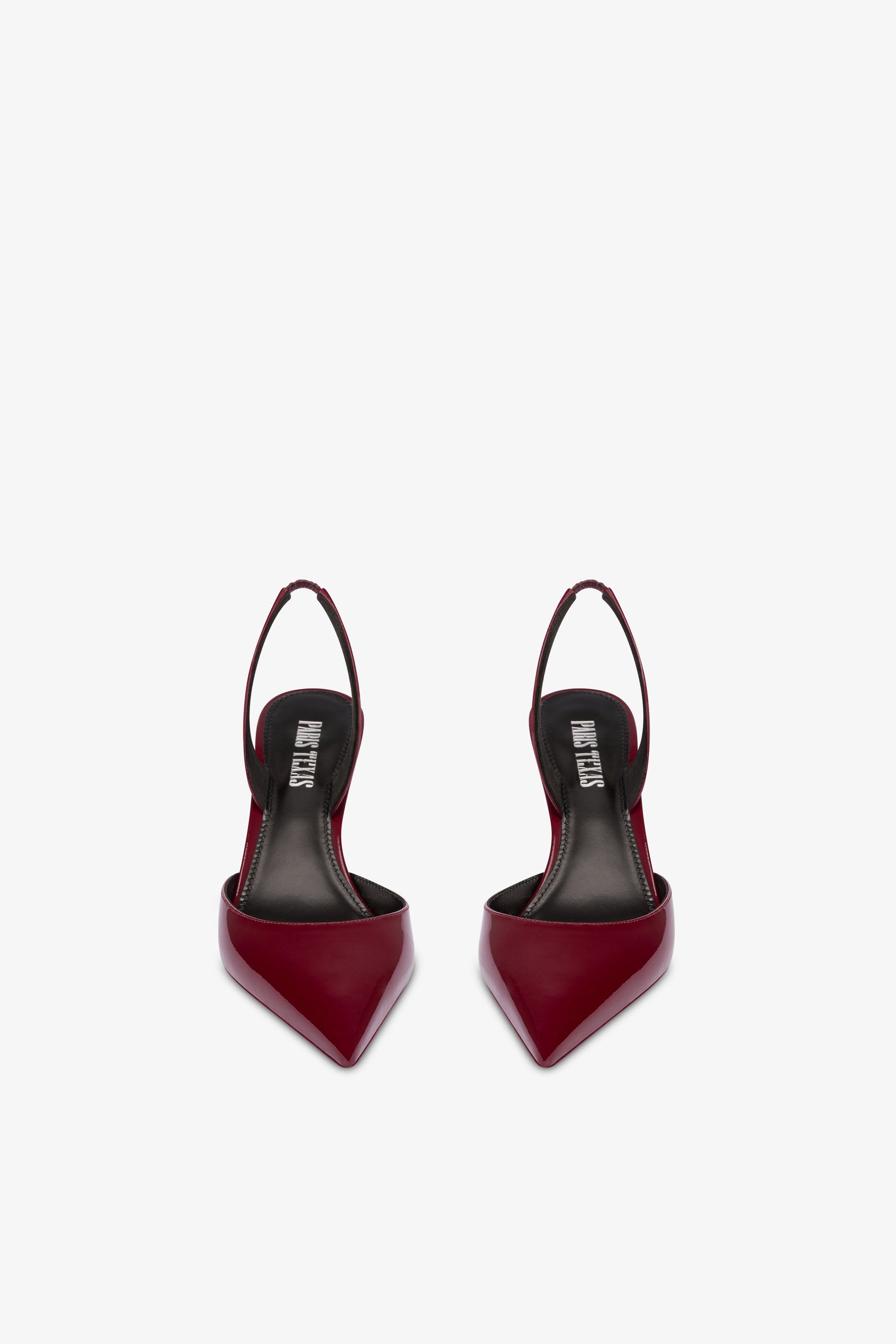 Long, pointed slingbacks in patent rouge noir leather