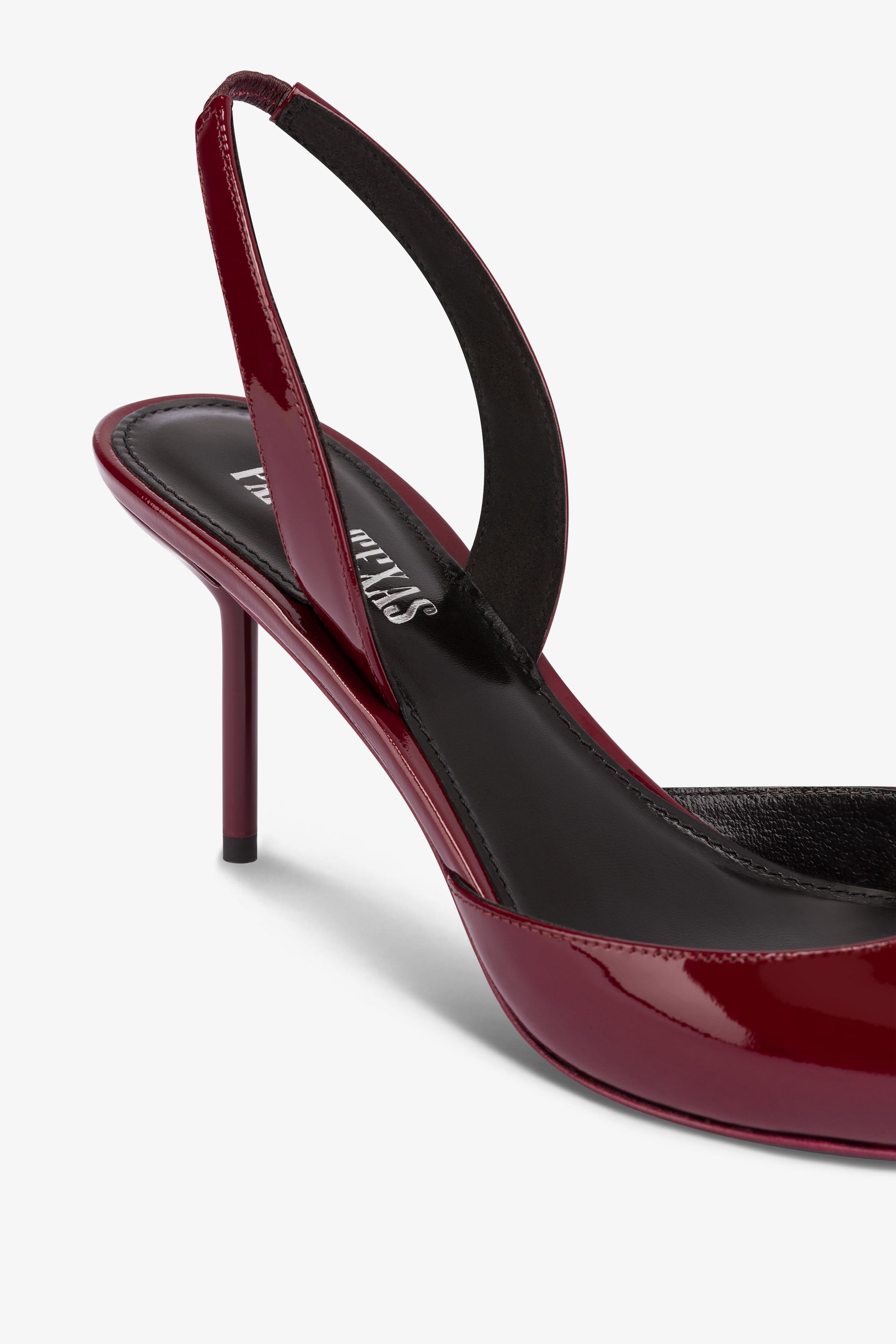 Long, pointed slingbacks in patent rouge noir leather