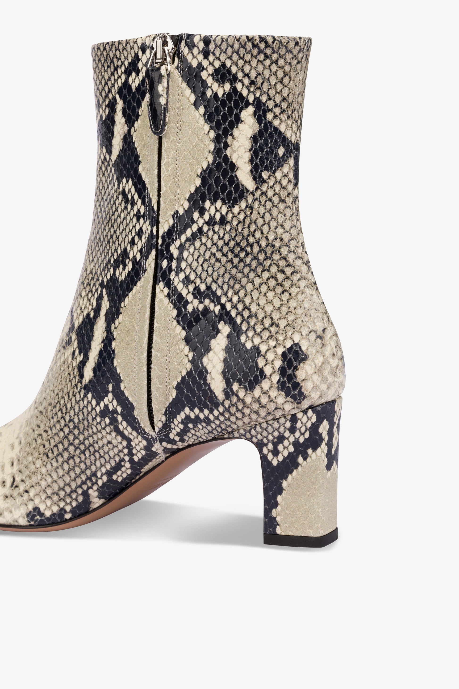 Pointed ankle boots in natural python-printed leather