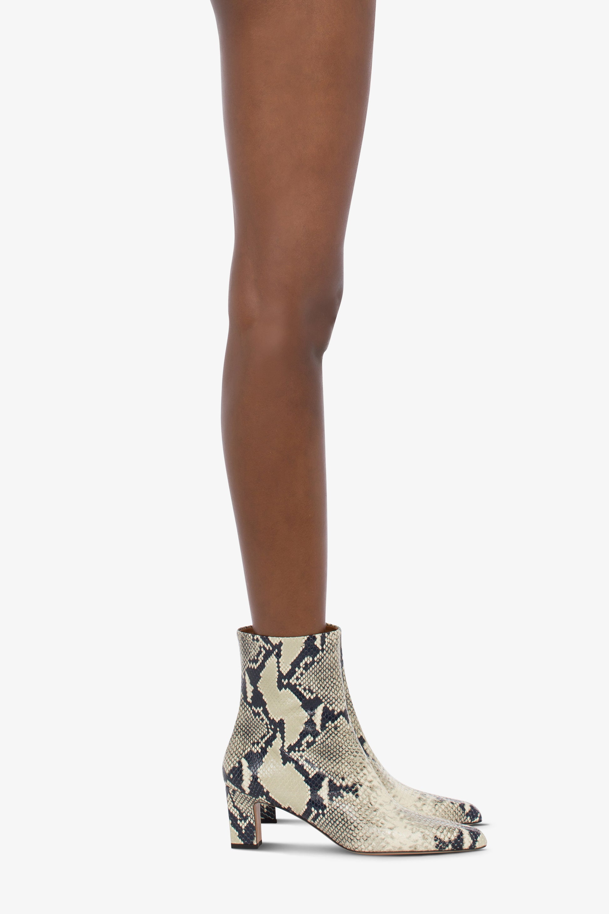 Pointed ankle boots in natural python-printed leather - Product worn