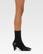 Botas de piel de cocodrilo negra y elastica