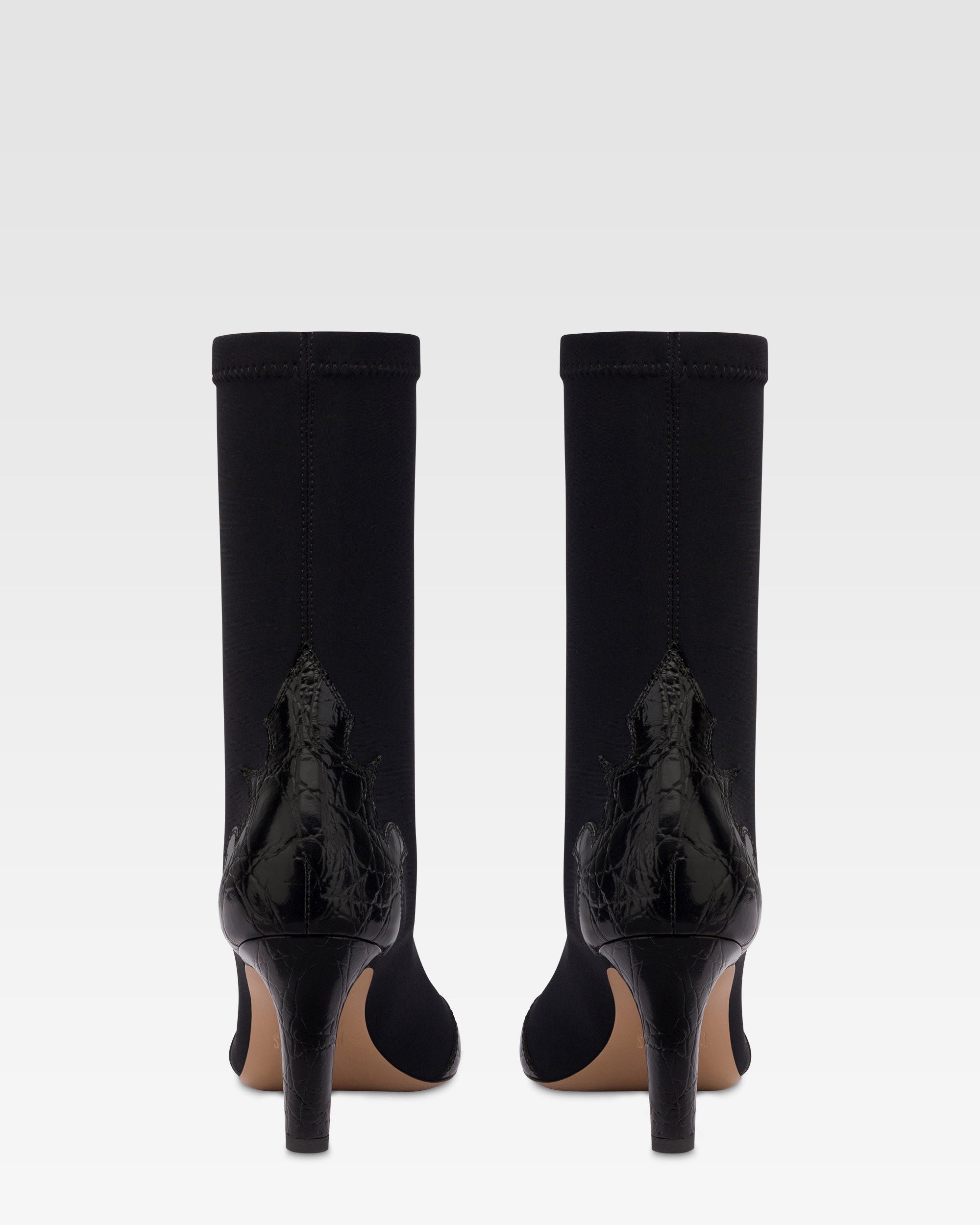 Boots in black croco-embossed and stretchy leather