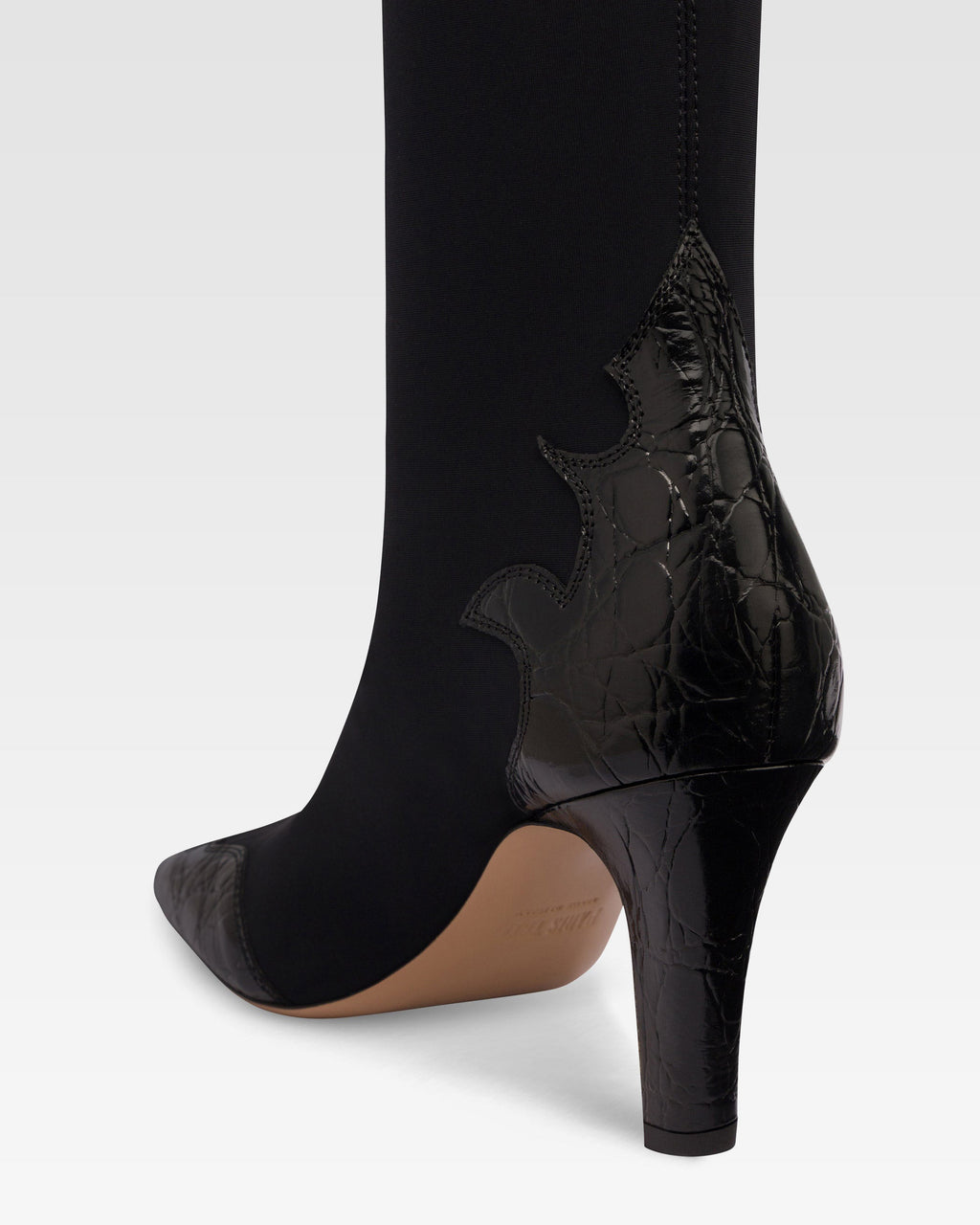 Botas de piel de cocodrilo negra y elastica