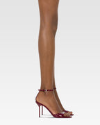 Sandals in rouge noir patent leather