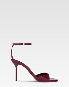 Sandals in rouge noir patent leather