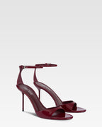 Sandals in rouge noir patent leather
