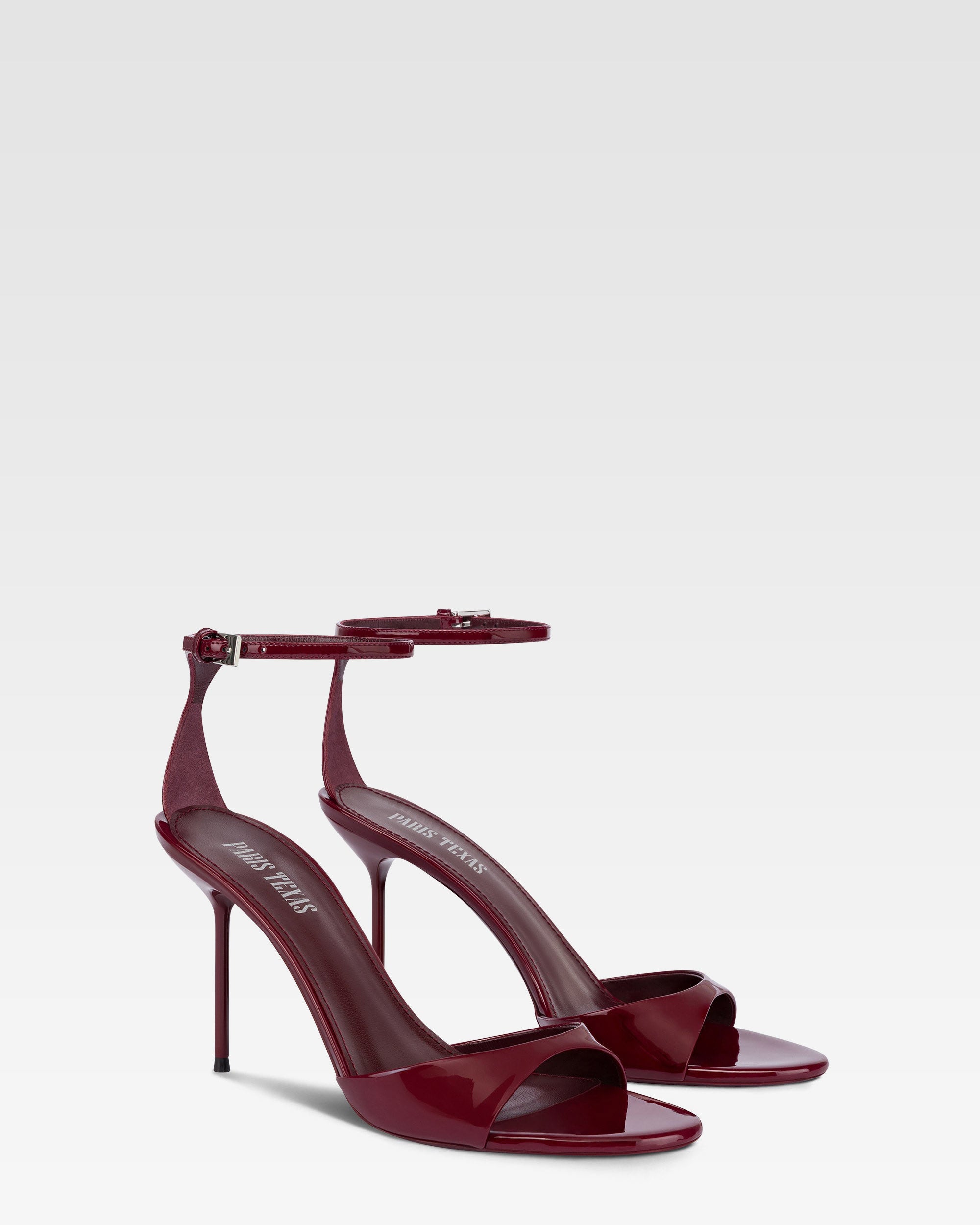 Sandals in rouge noir patent leather