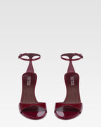 Sandals in rouge noir patent leather