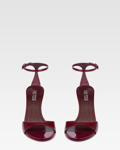 Sandals in rouge noir patent leather