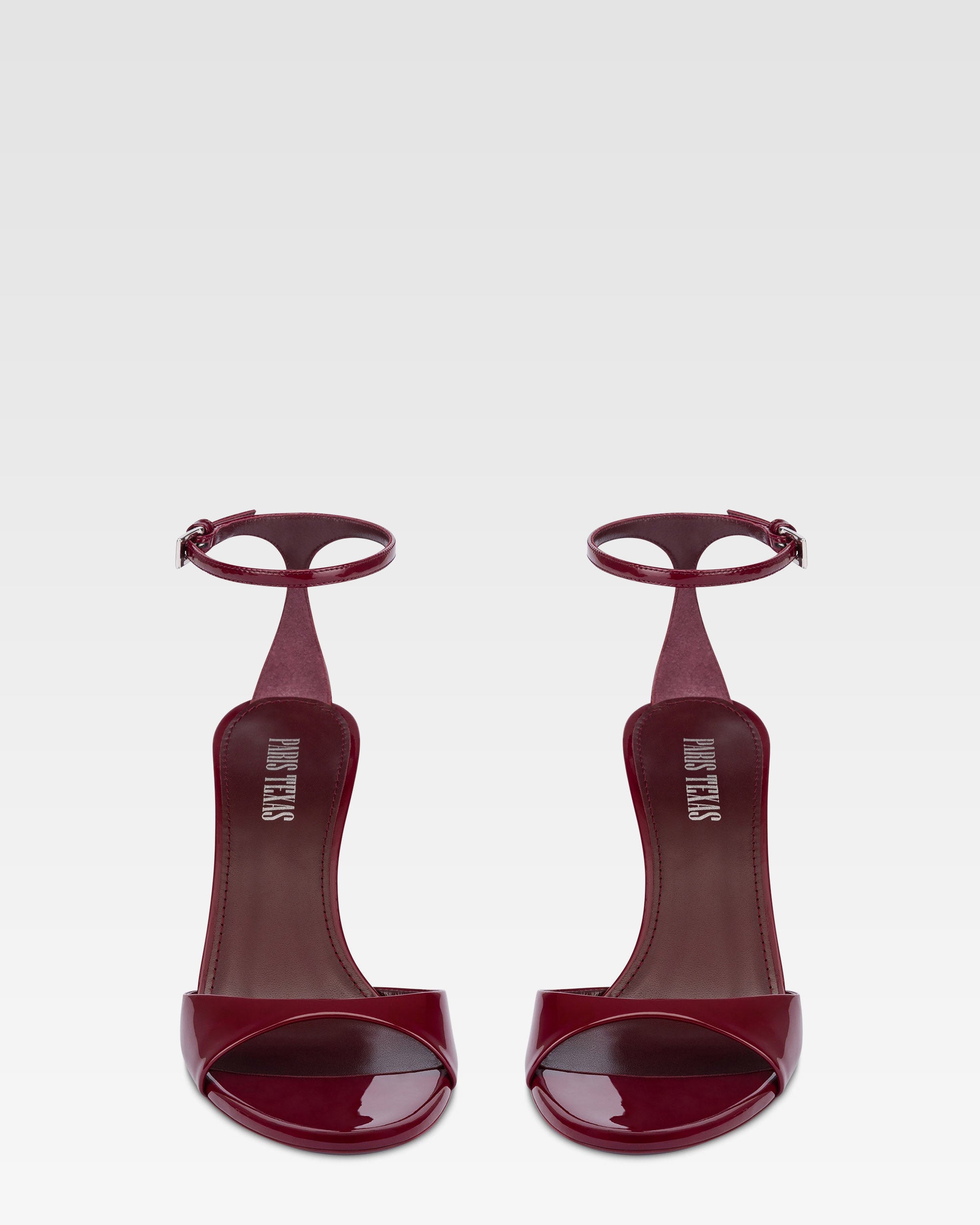 Sandals in rouge noir patent leather
