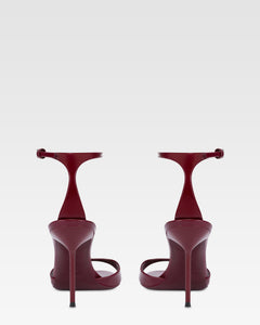 Sandals in rouge noir patent leather