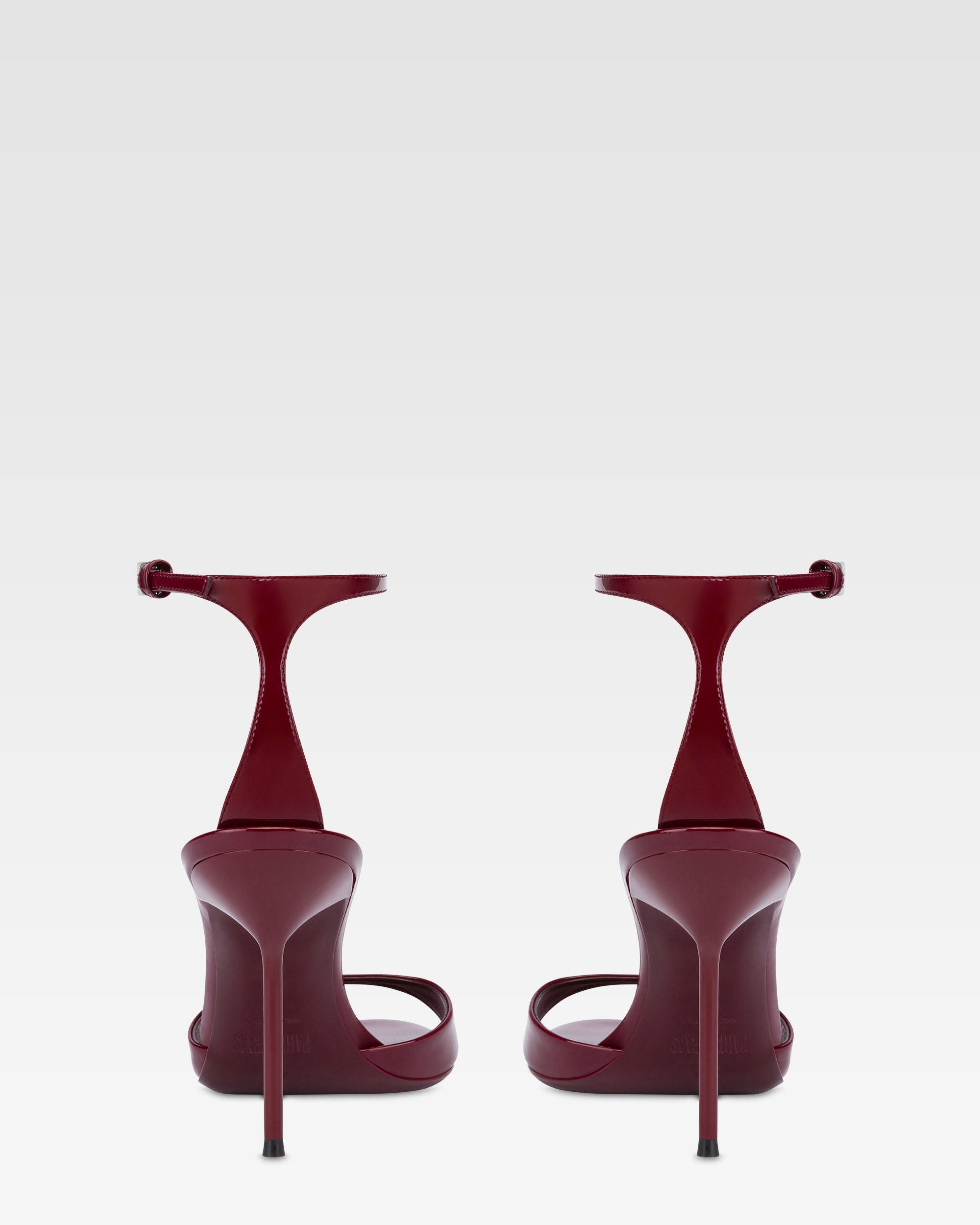 Sandals in rouge noir patent leather