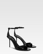 Sandals in black patent leather