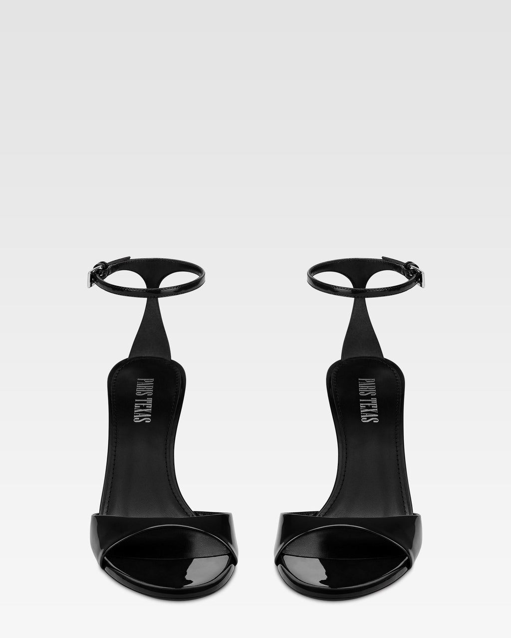 Sandals in black patent leather