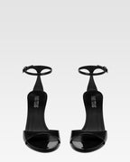 Sandals in black patent leather