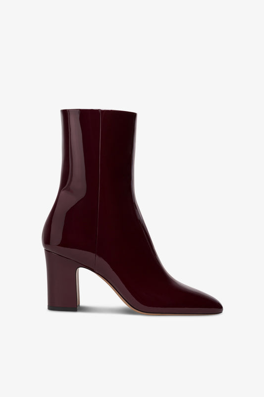 Ankle boots in rouge noir patent leather.