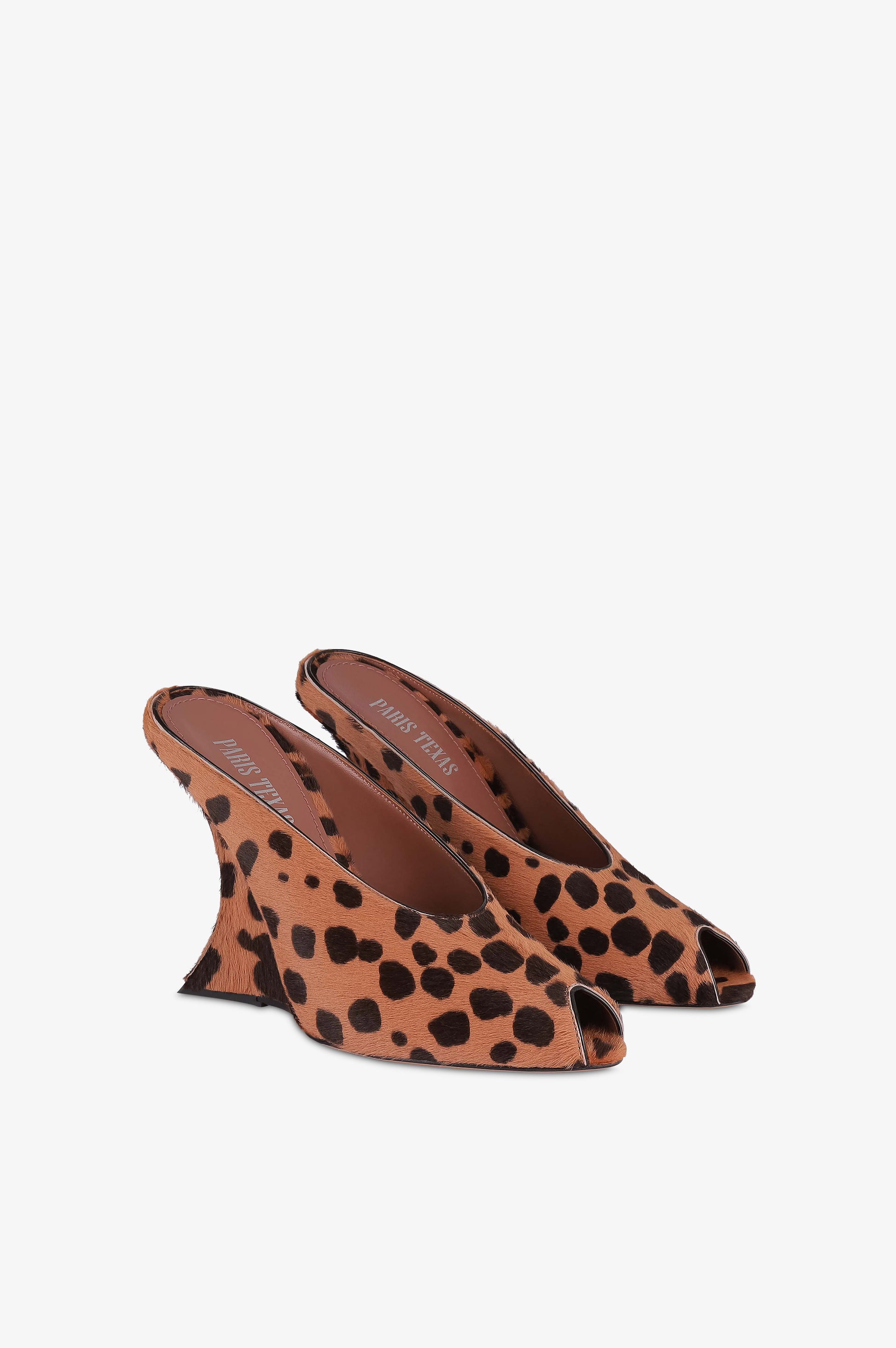 Open-toe sabots in caramel and dark brown printed cowhide