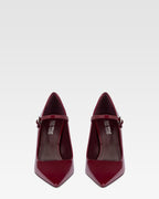 Pumps in rouge noir patent leather