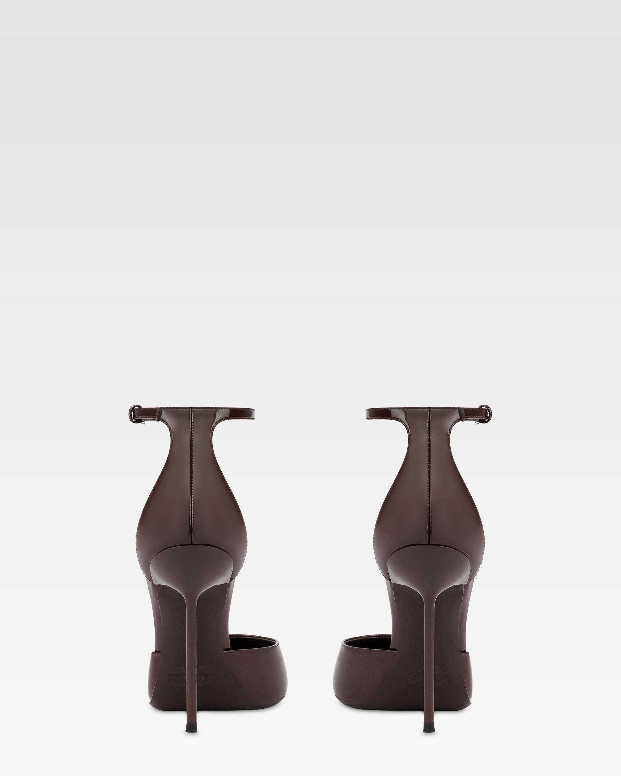 Ankle-strap pumps in ebony patent leather