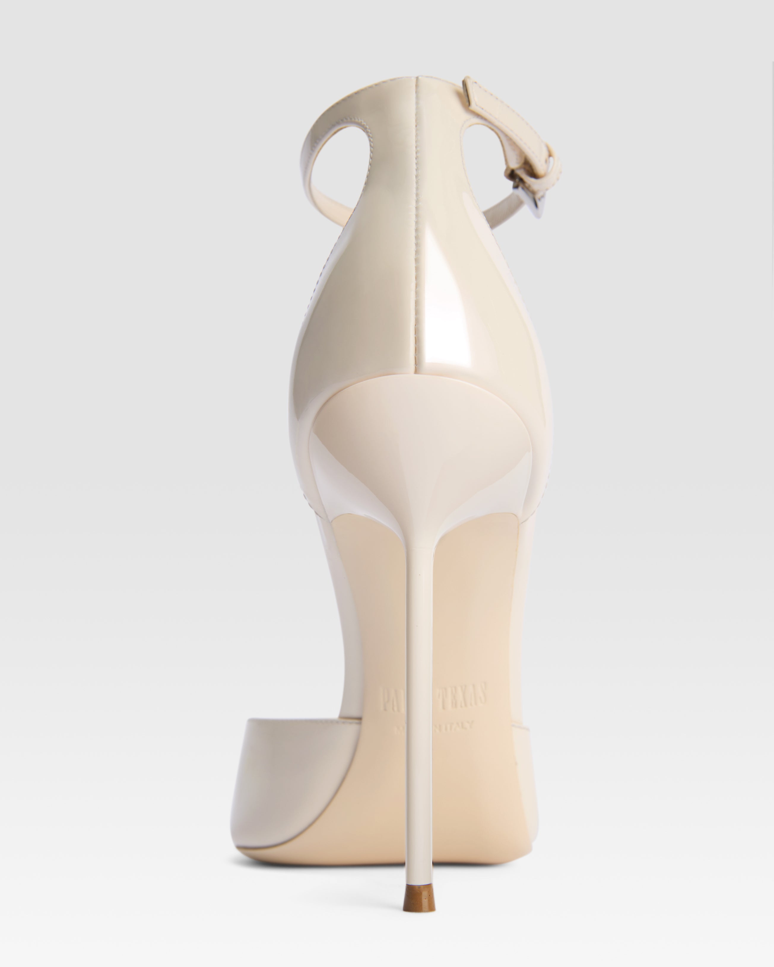 Ankle-strap pumps in ivory patent leather