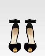 Sandals in black velvet with gold detailing.