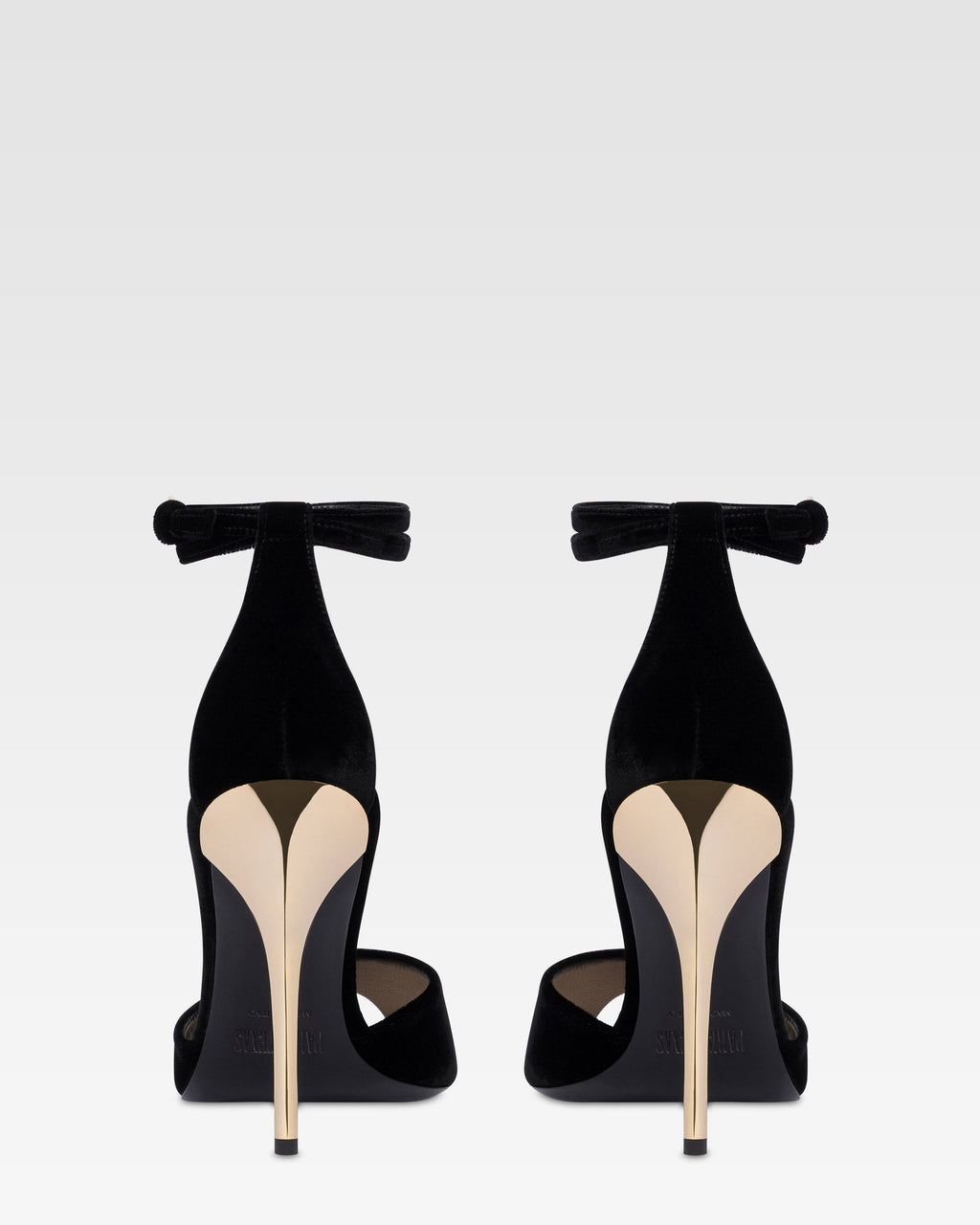 Sandals in black velvet with gold detailing.