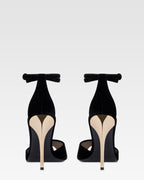 Sandals in black velvet with gold detailing.