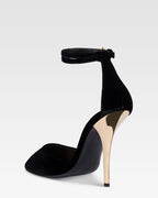 Sandals in black velvet with gold detailing.