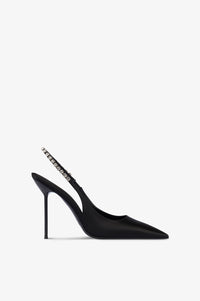Slingbacks in black satin with stud detailing.