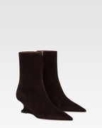 Ankle boots in ebony calf suede leather.