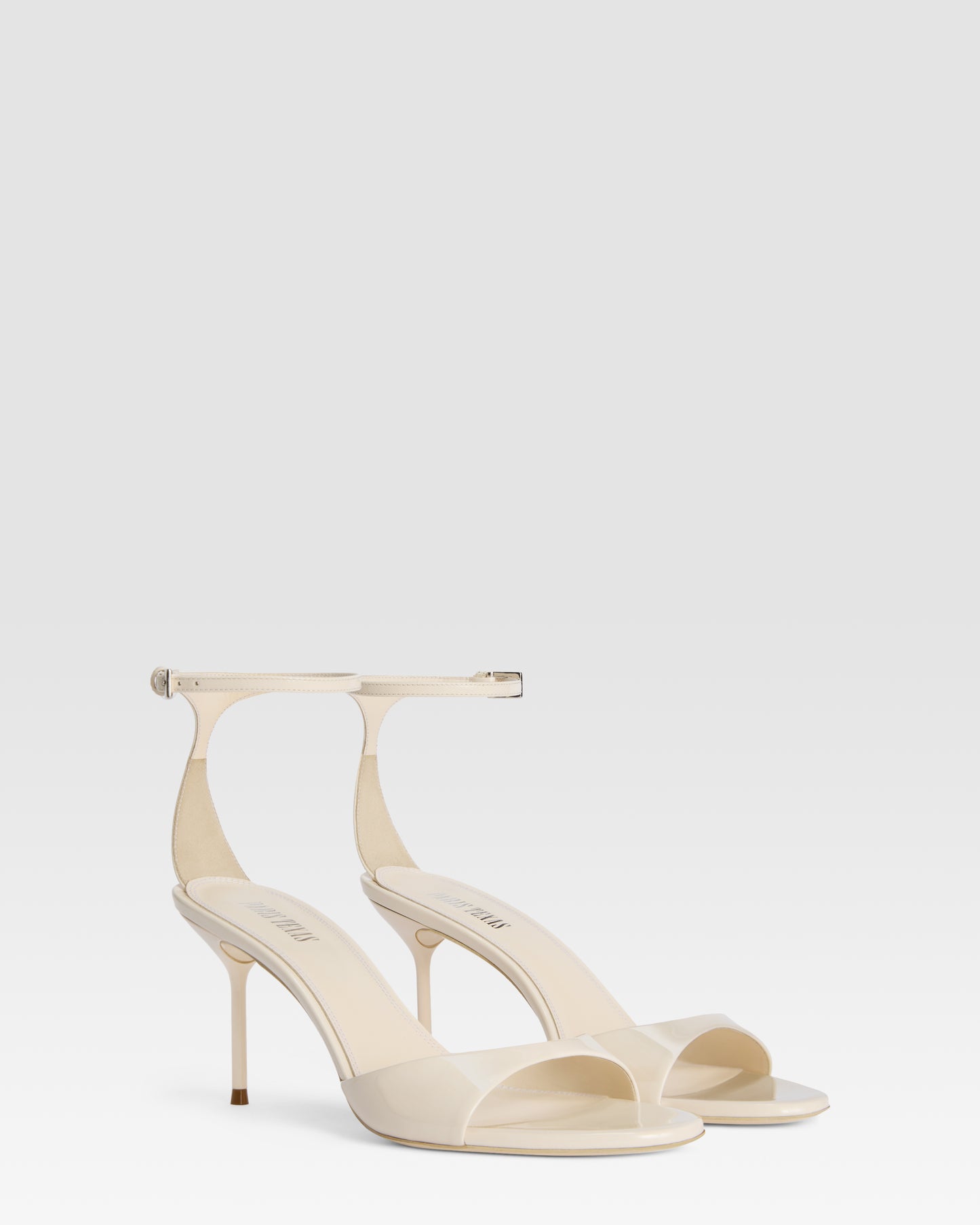 Ankle-strap sandals in ivory patent leather