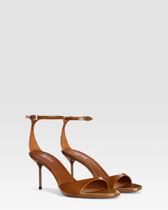 Ankle-strap sandals in coffee patent leather