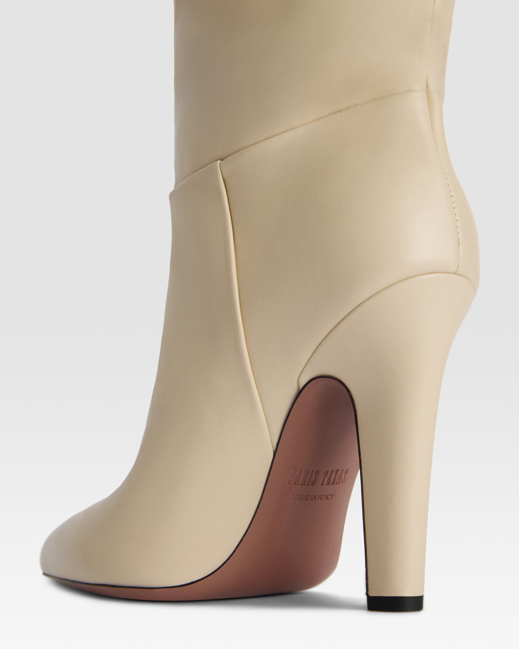 Boots in bone-colored leather