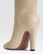 Boots in bone-colored leather