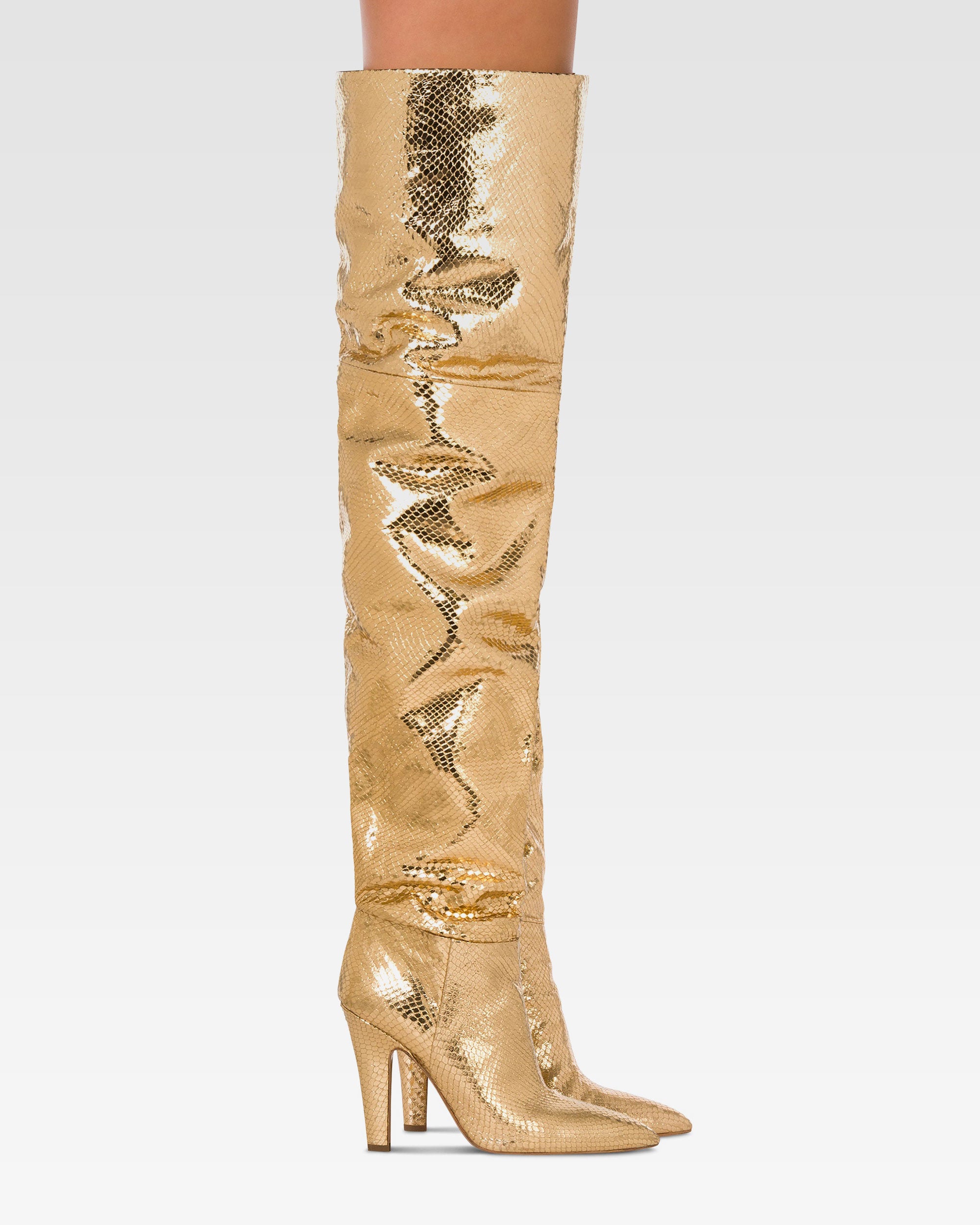 Over-the-knee boots in gold, metallic-effect printed python leather.