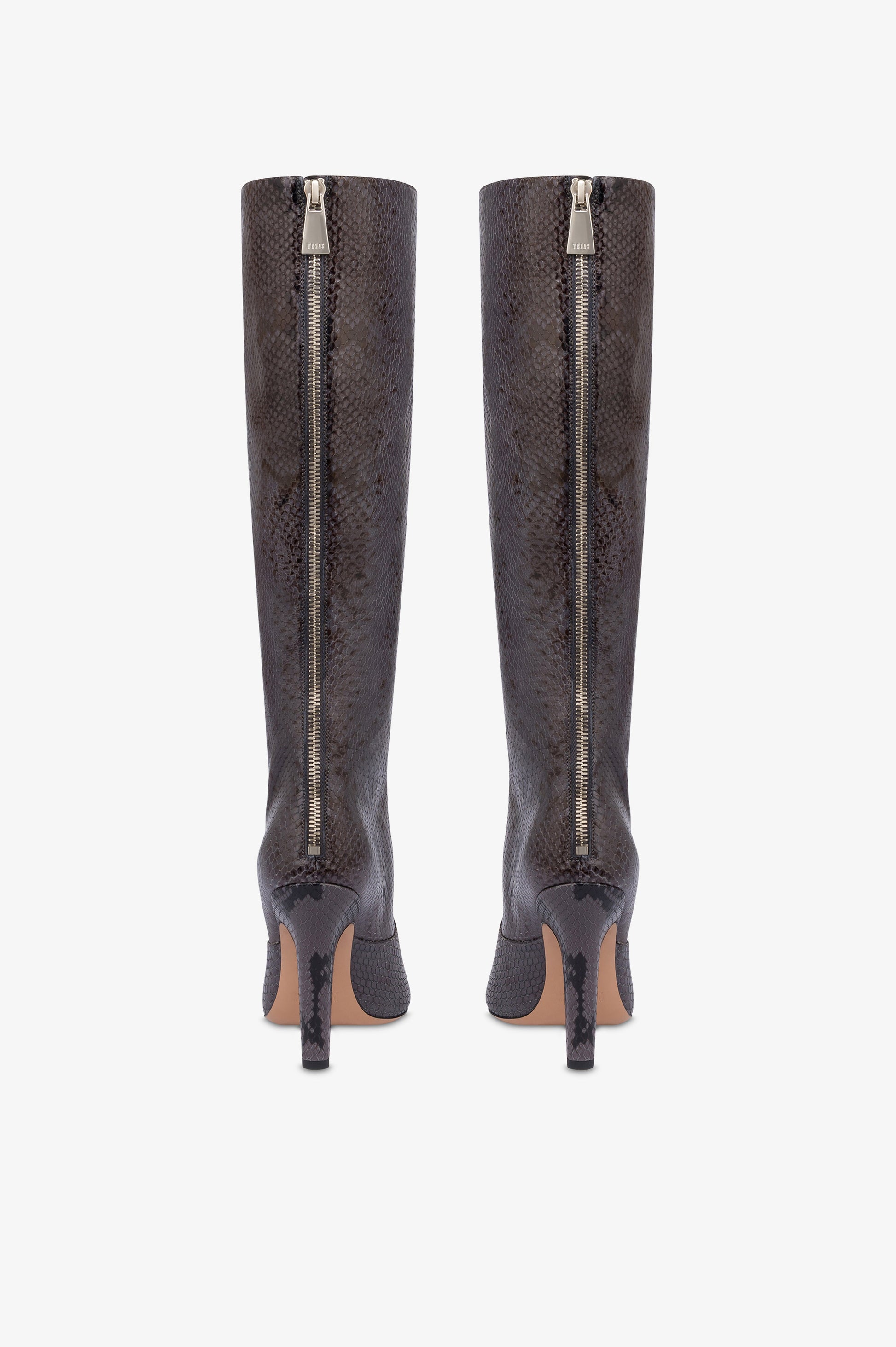 Boots in ash printed python leather.