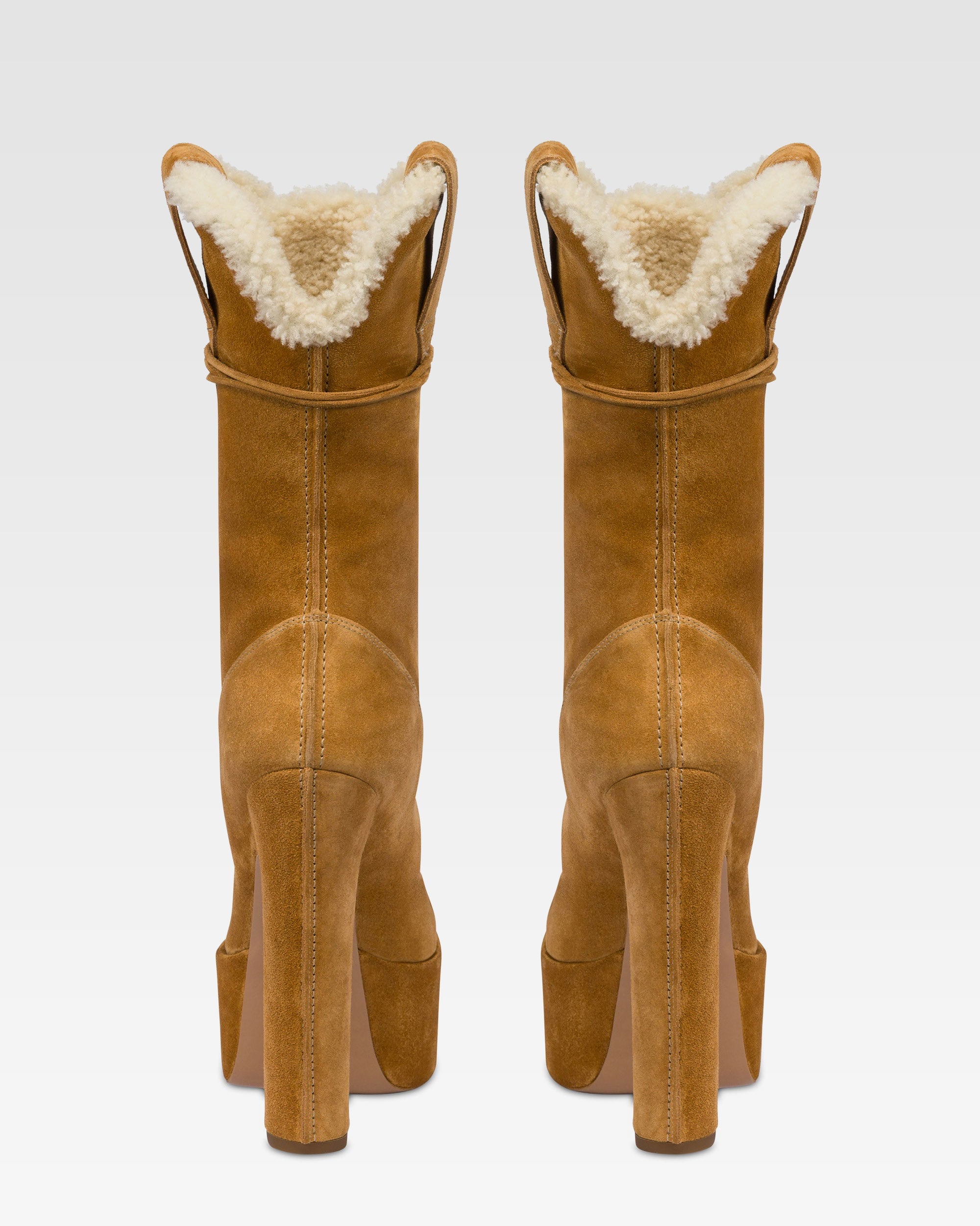 Platform boots in beige calf suede leather.