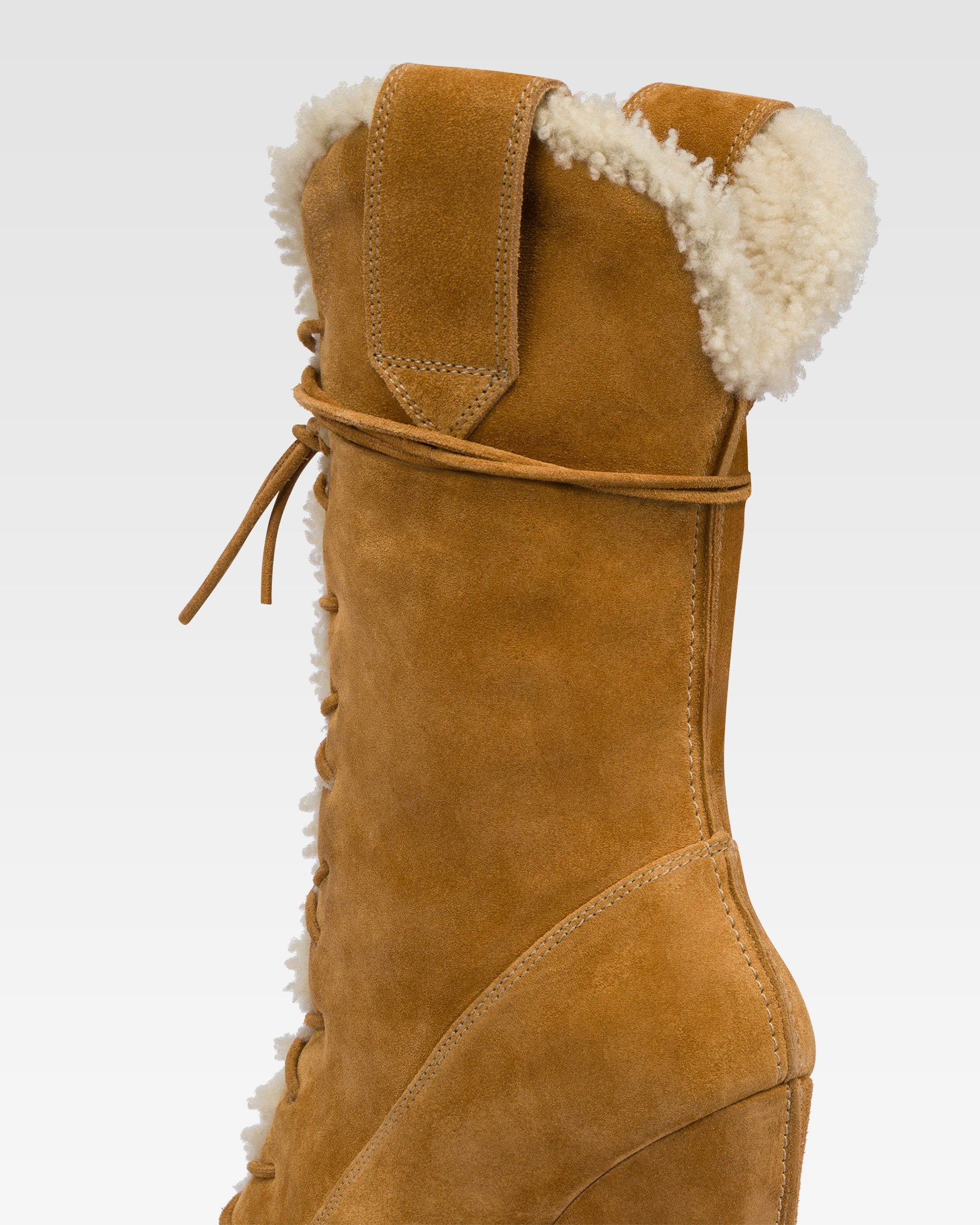Platform boots in beige calf suede leather.