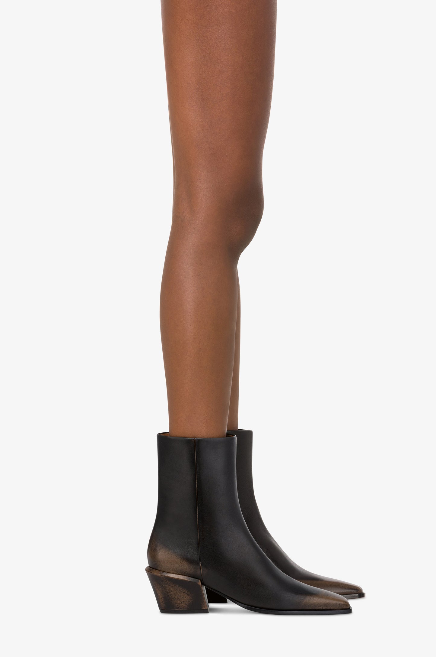 Ankle boots in black brushed leather.