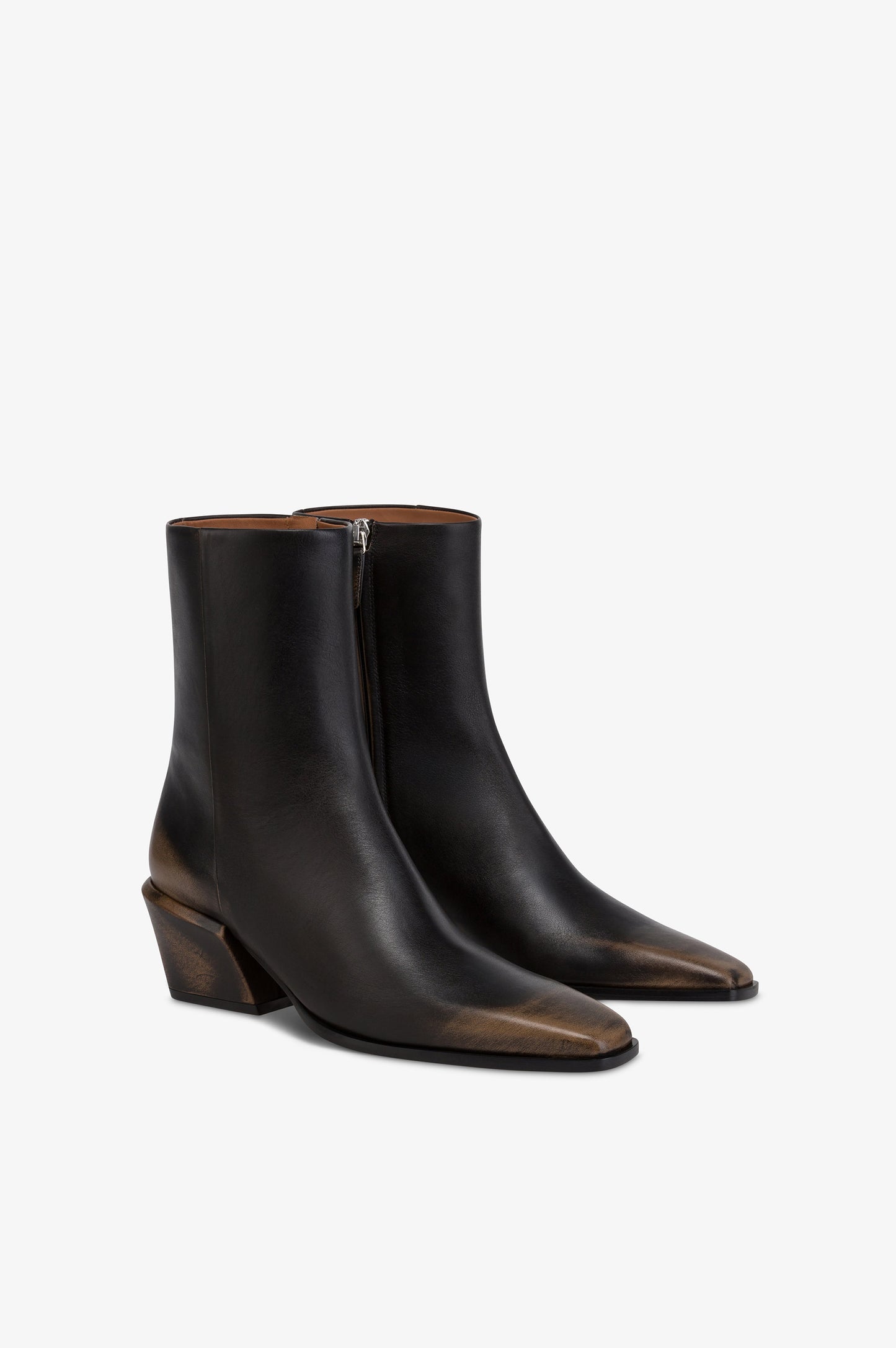 Ankle boots in black brushed leather.