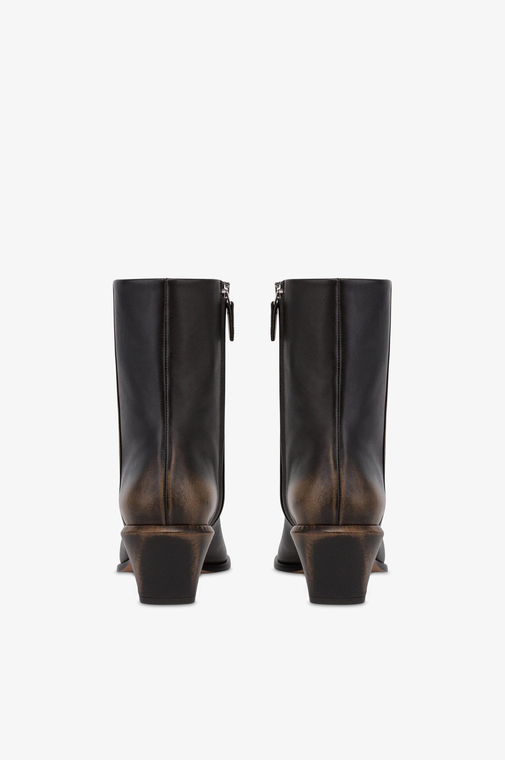 Ankle boots in black brushed leather.