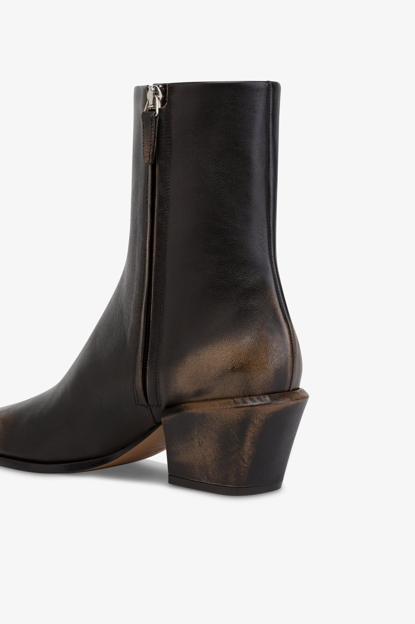 Ankle boots in black brushed leather.