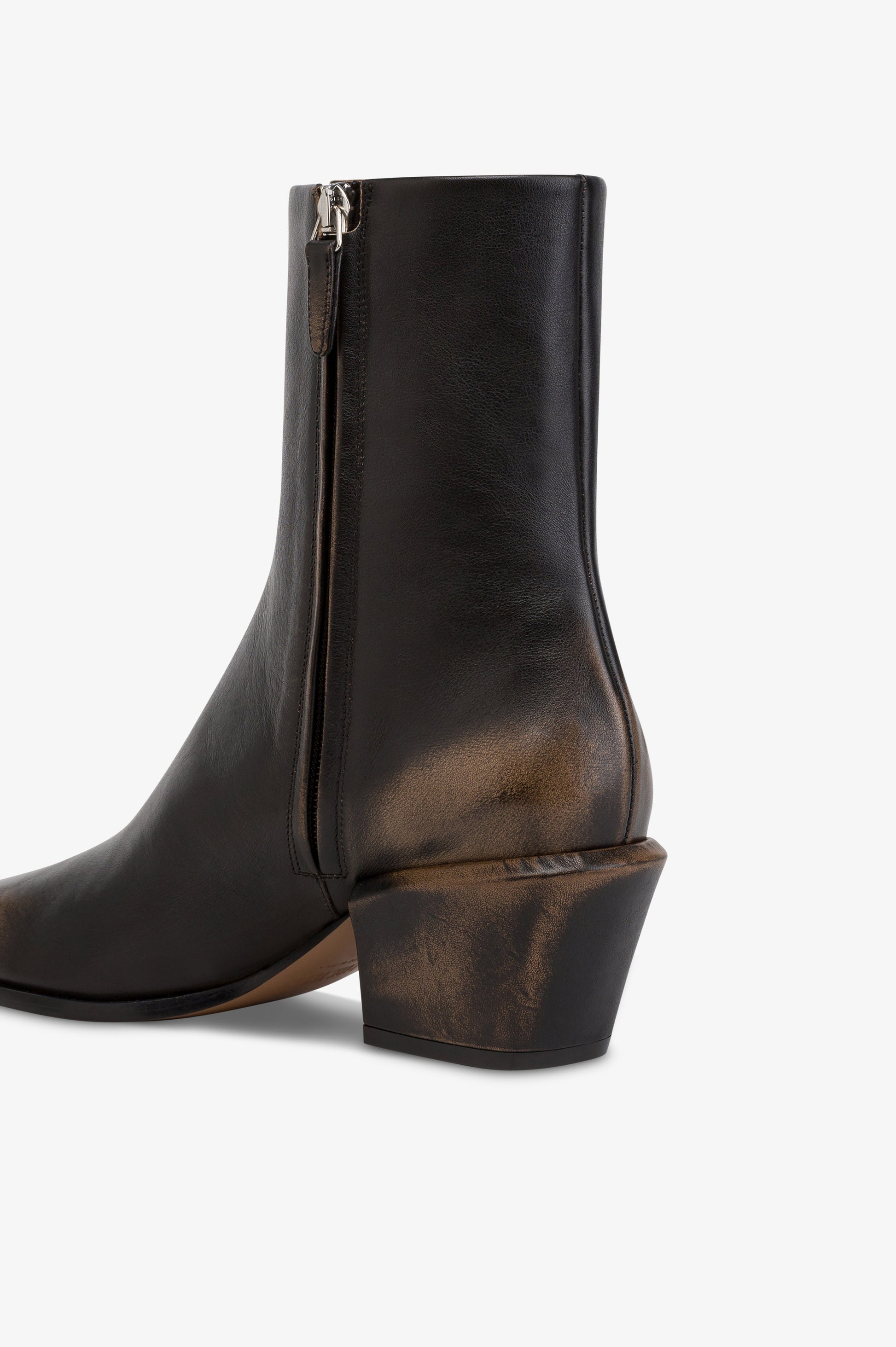 Ankle boots in black brushed leather.