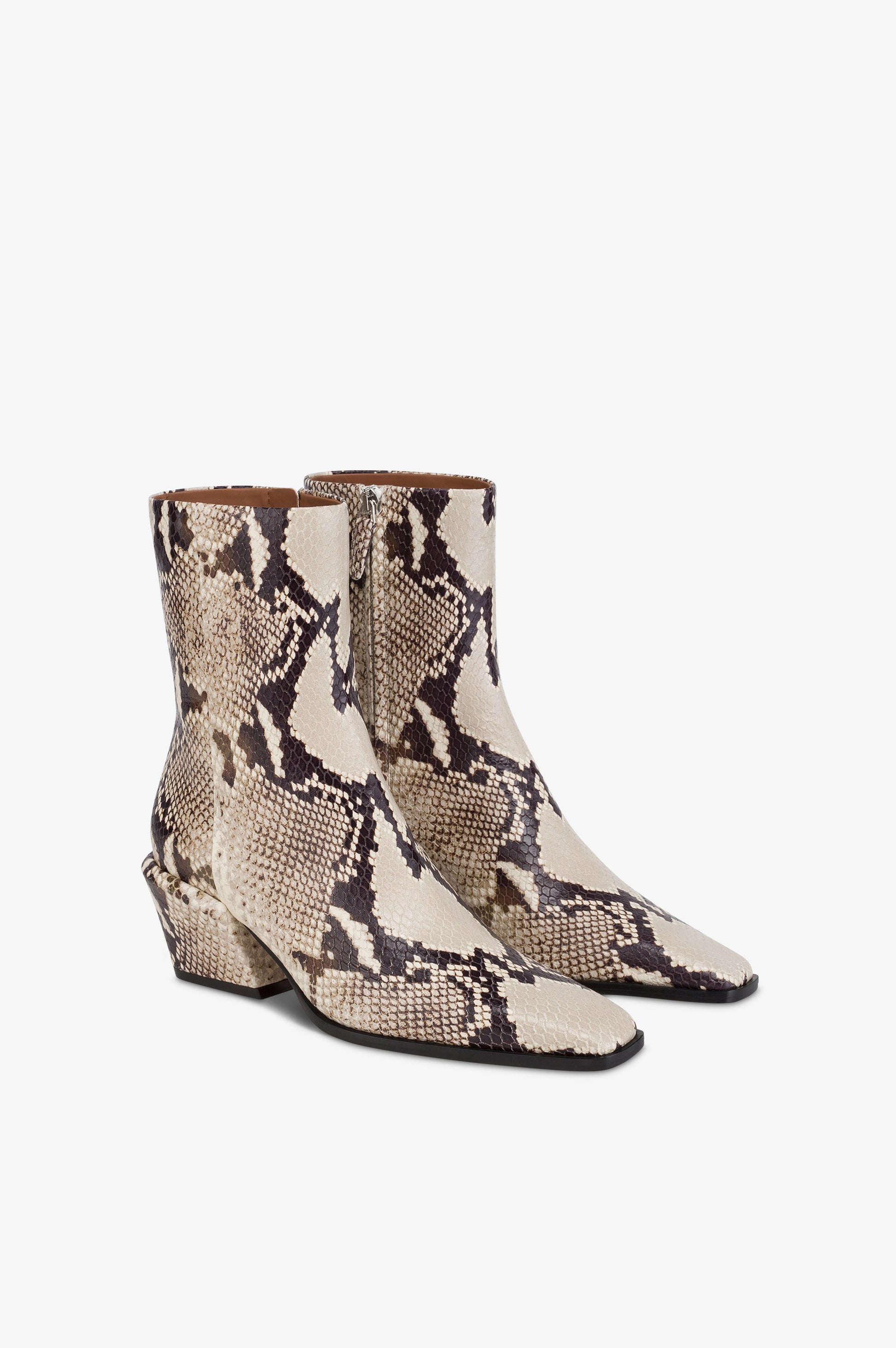 Ankle boots in natural printed python leather.