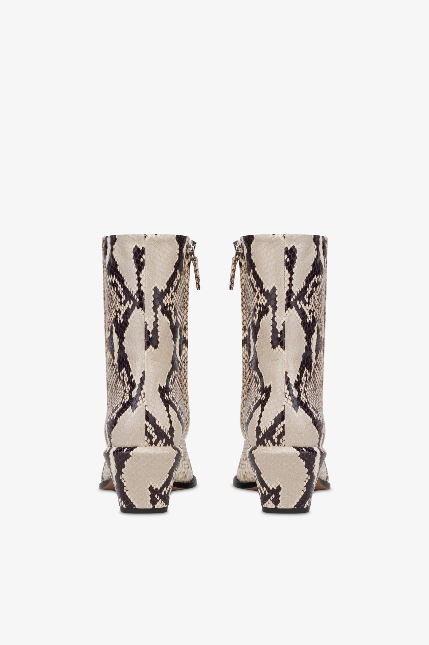 Ankle boots in natural printed python leather.