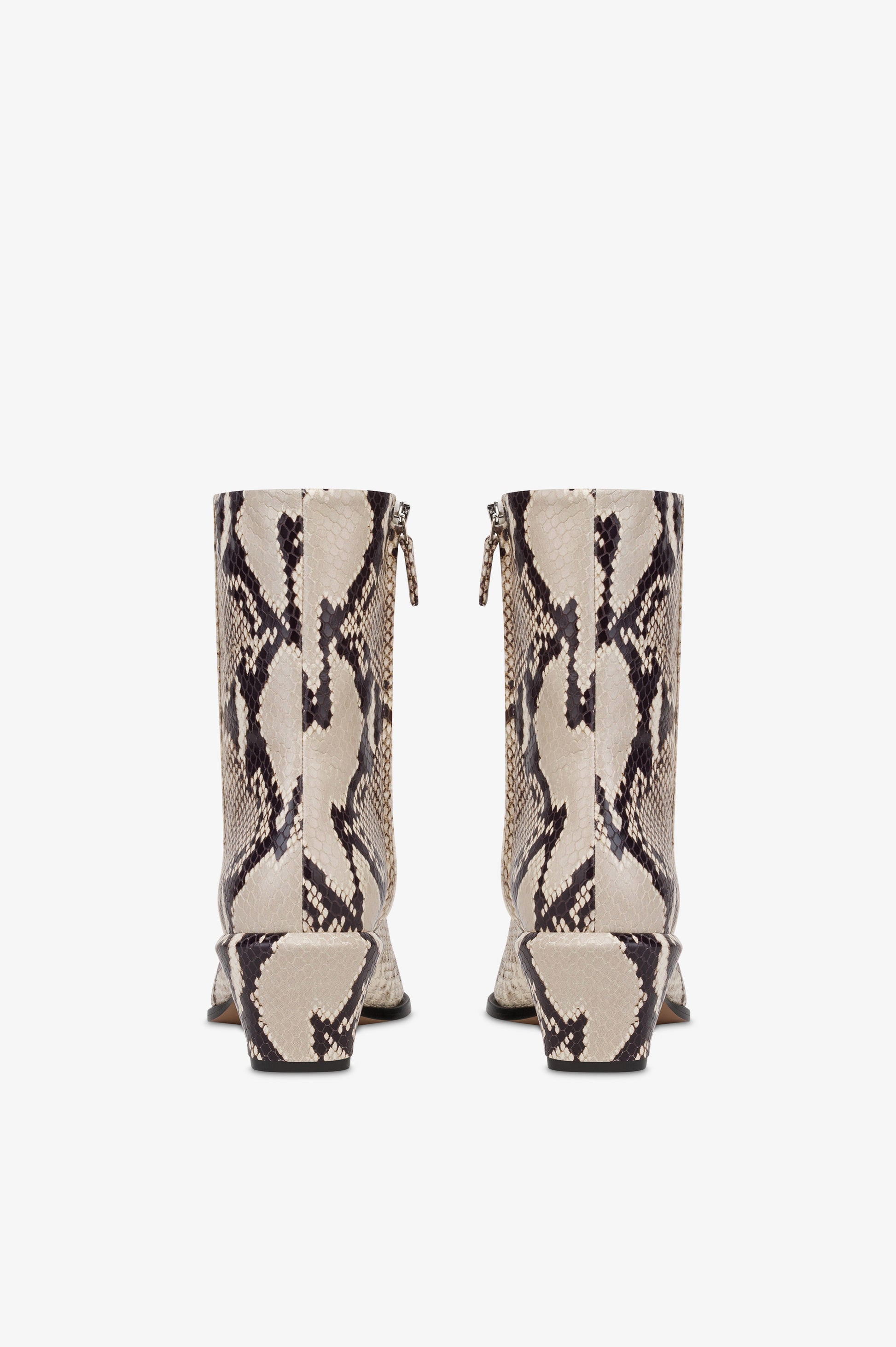 Ankle boots in natural printed python leather.